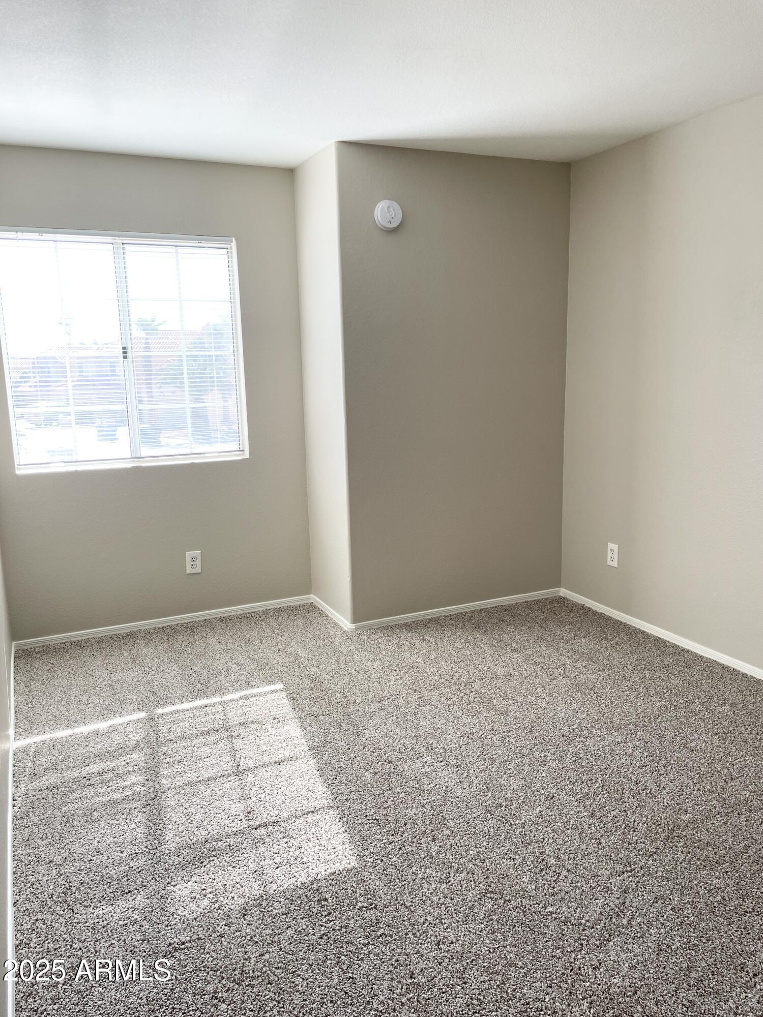 14452 South 43rd Street Phoenix, AZ 85044 - Photo 28 of 33 an empty room with an empty space and window