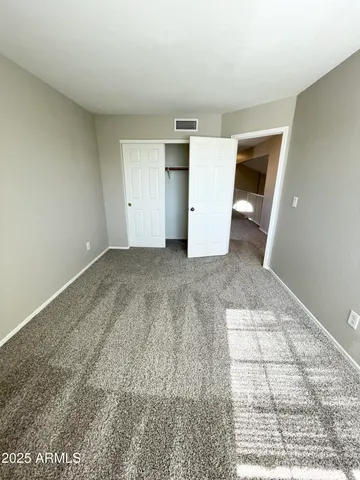 a view of an empty room and window