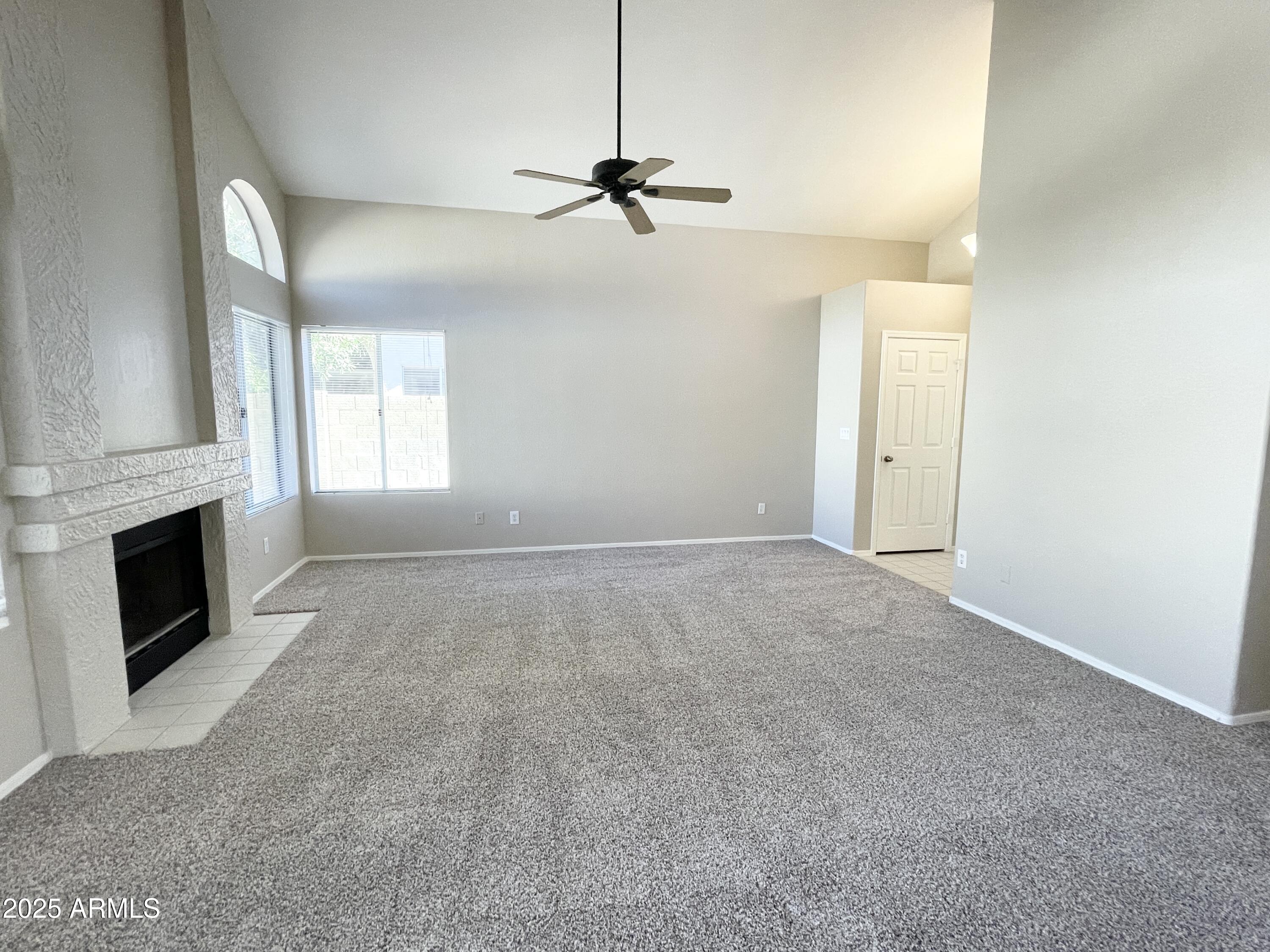14452 South 43rd Street Phoenix, AZ 85044 - Photo 8 of 33 a view of a livingroom with a fireplace and window