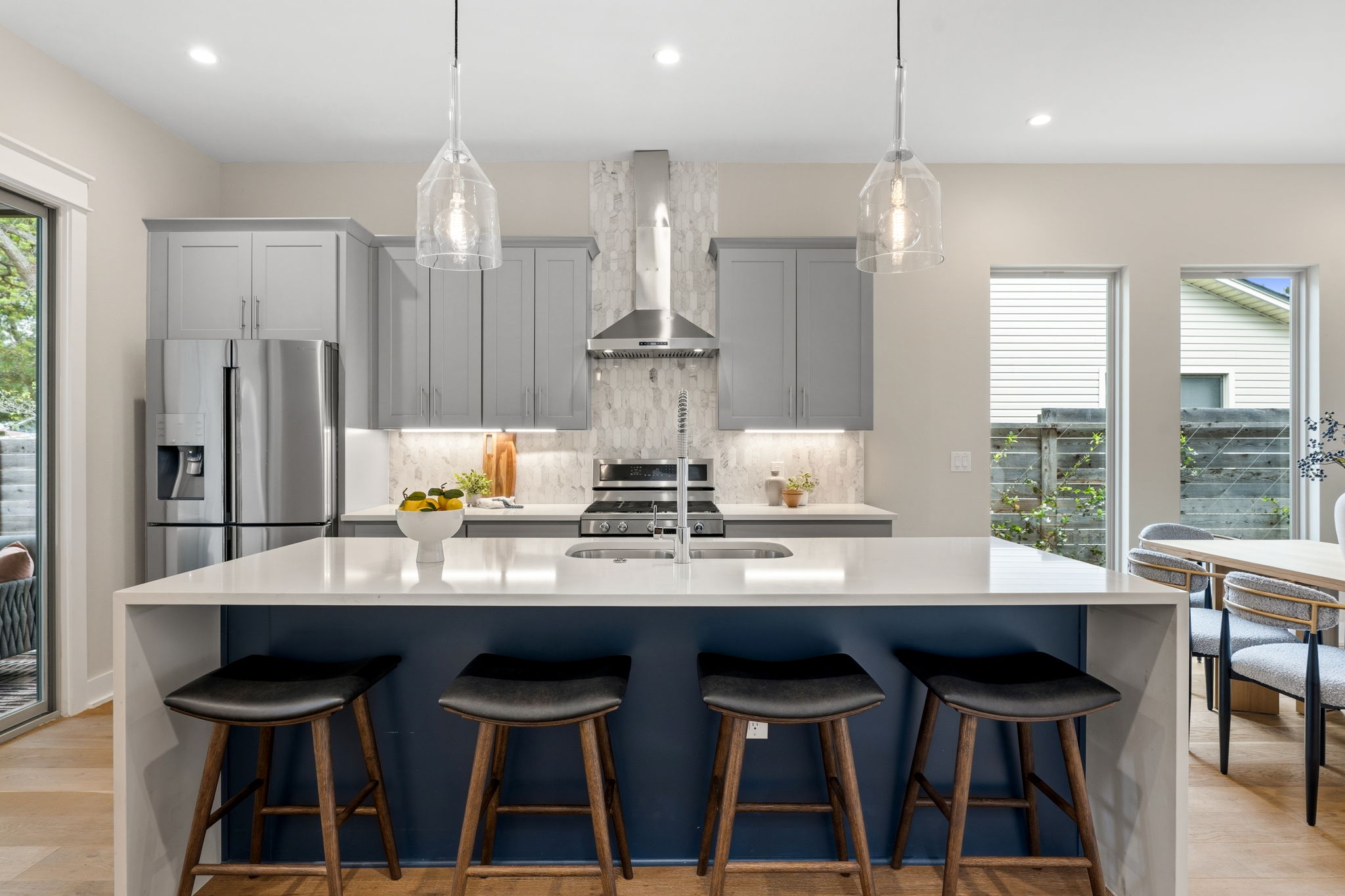 1409 Alegria Road, Unit B Austin, TX 78757 - Photo 12 of 39 a kitchen with kitchen island granite countertop a table and chairs in it