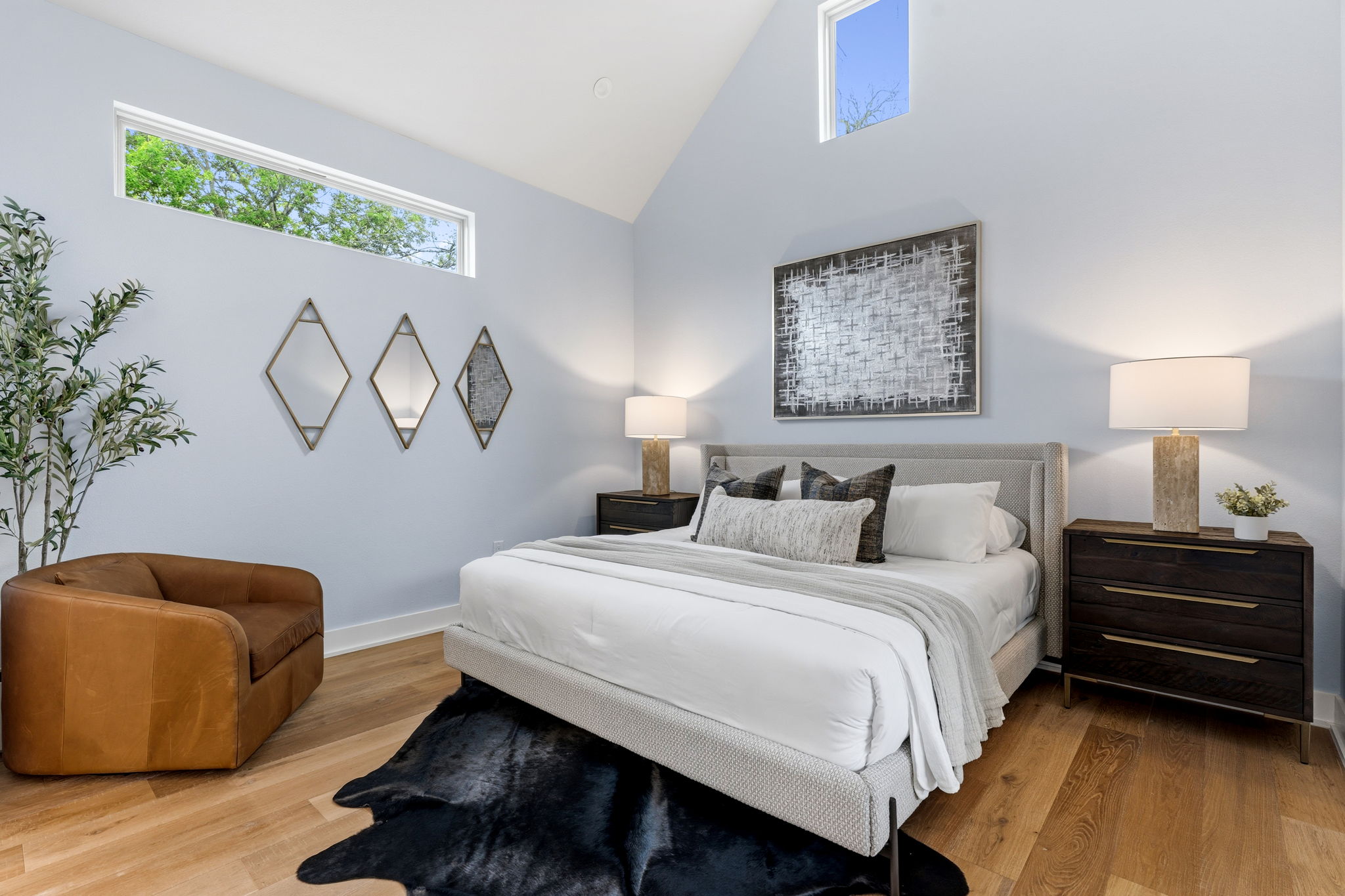 1409 Alegria Road, Unit B Austin, TX 78757 - Photo 16 of 39 The private primary bedroom on main floor with cathedral height ceilings and no shared walls with the rest of the home.