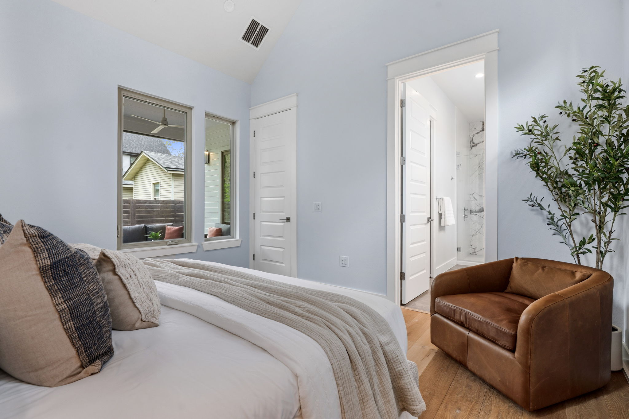 1409 Alegria Road, Unit B Austin, TX 78757 - Photo 17 of 39 a bedroom with a bed couch and window