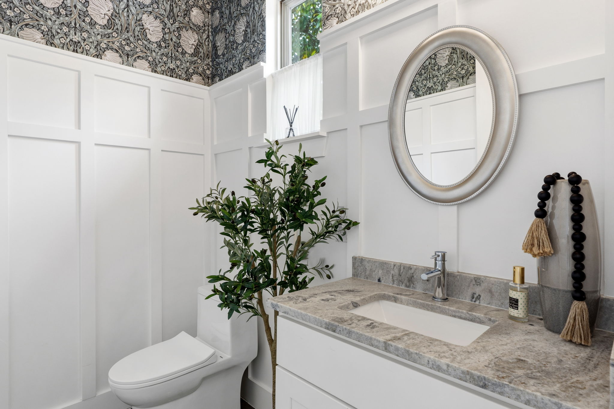 1409 Alegria Road, Unit B Austin, TX 78757 - Photo 22 of 39 a bathroom with a toilet a sink and a mirror