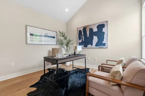 a picture of a bench in front of a window