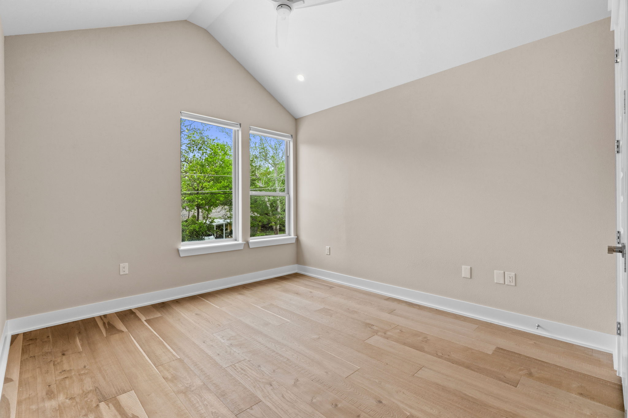 1409 Alegria Road, Unit B Austin, TX 78757 - Photo 26 of 39 a view of an empty room with wooden floor and a window