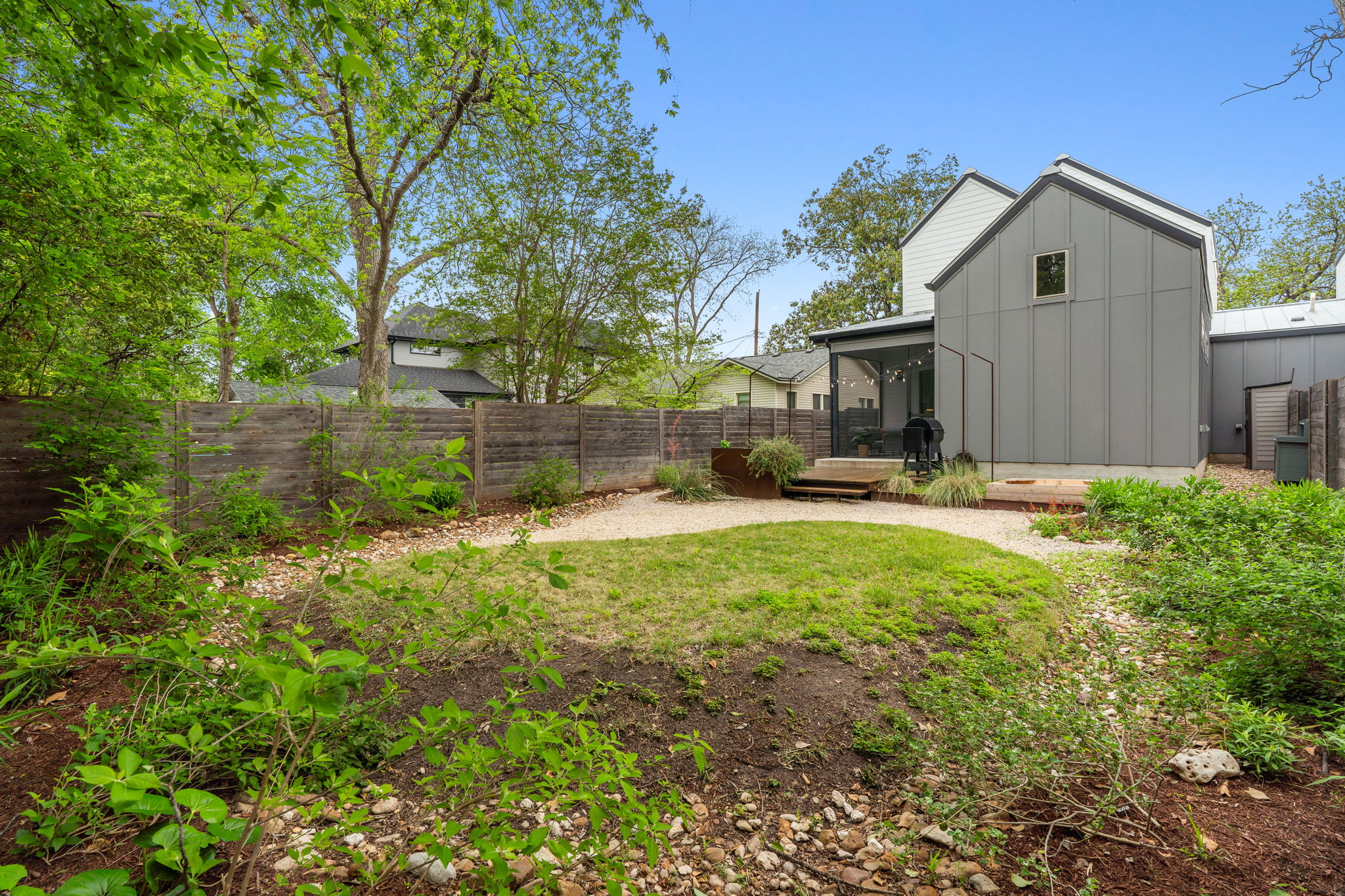 1409 Alegria Road, Unit B Austin, TX 78757 - Photo 32 of 39 a view of a house with backyard and sitting area