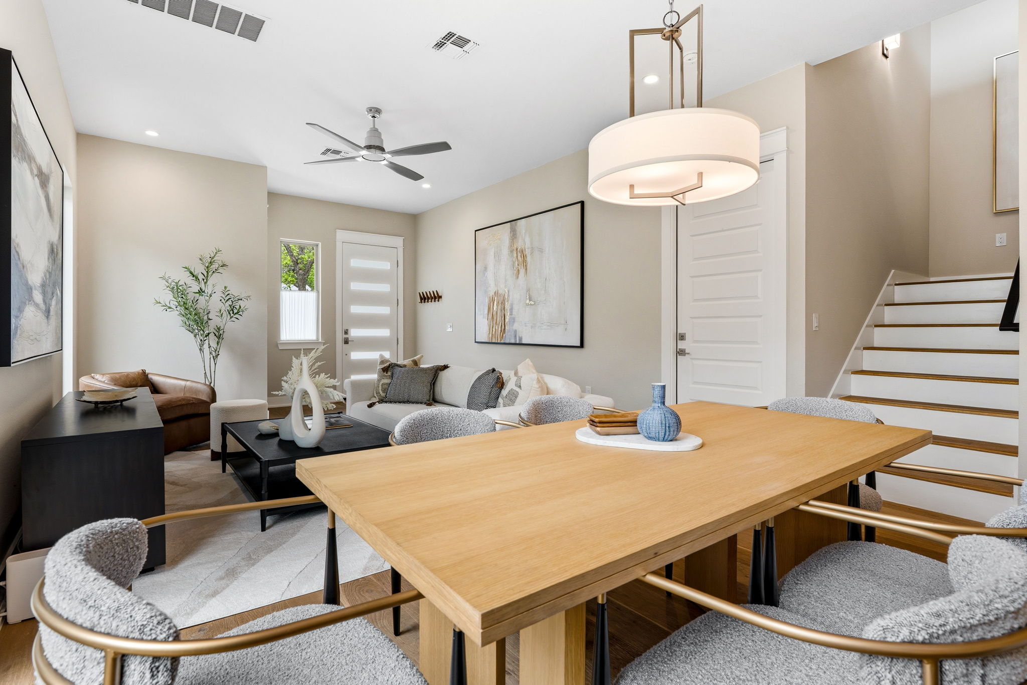1409 Alegria Road, Unit B Austin, TX 78757 - Photo 8 of 39 a dining room with wooden floor a chandelier fan a wooden table and chairs