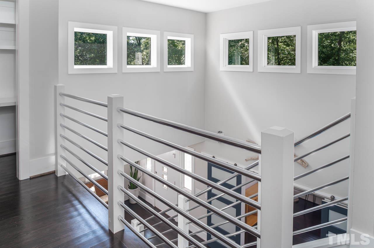 384 Booth Road Chapel Hill, NC 27516 - Photo 16 of 30 a view of an entryway with wooden floor and windows