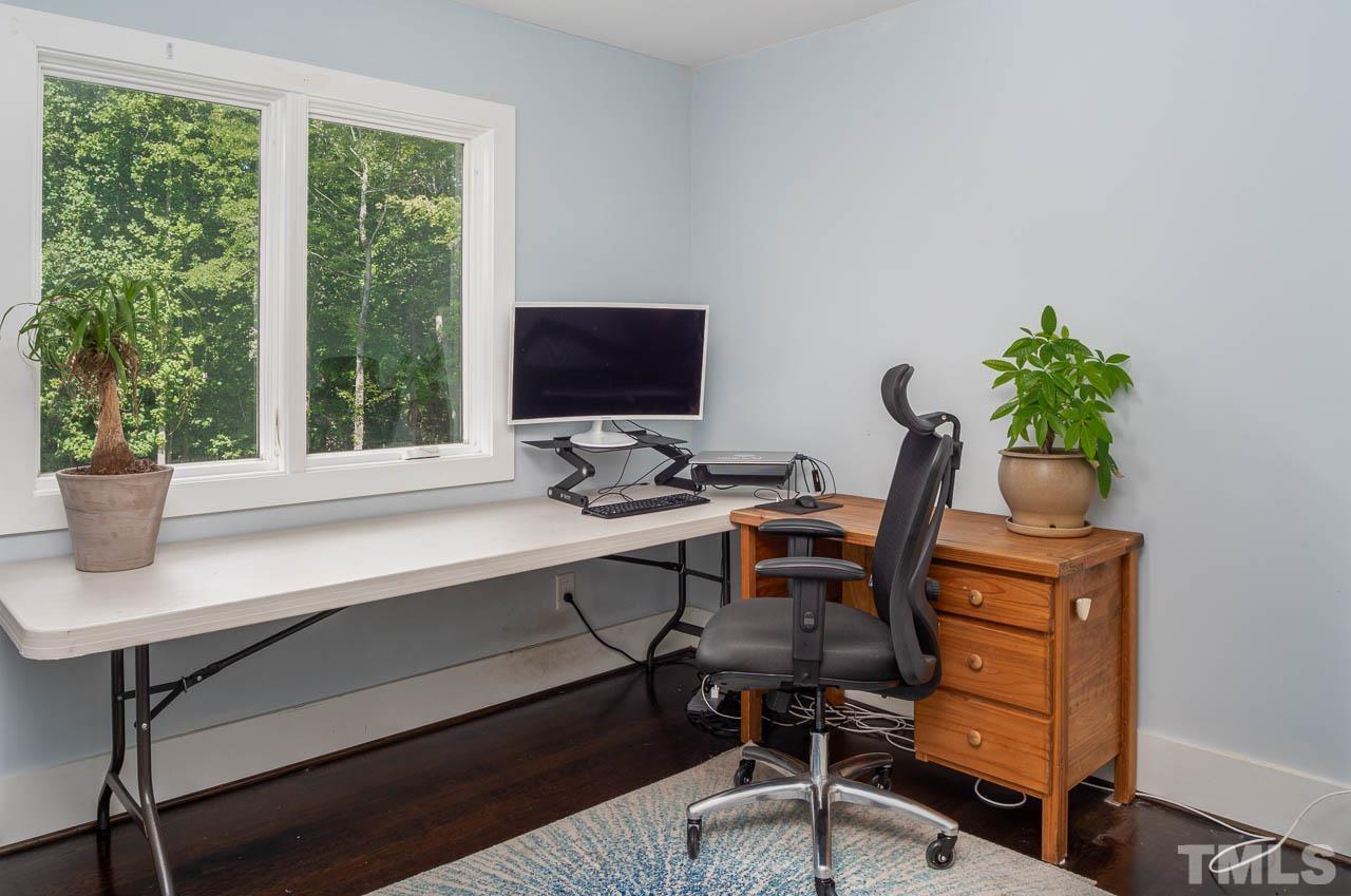 384 Booth Road Chapel Hill, NC 27516 - Photo 20 of 30 a view of a workspace with furniture and a window