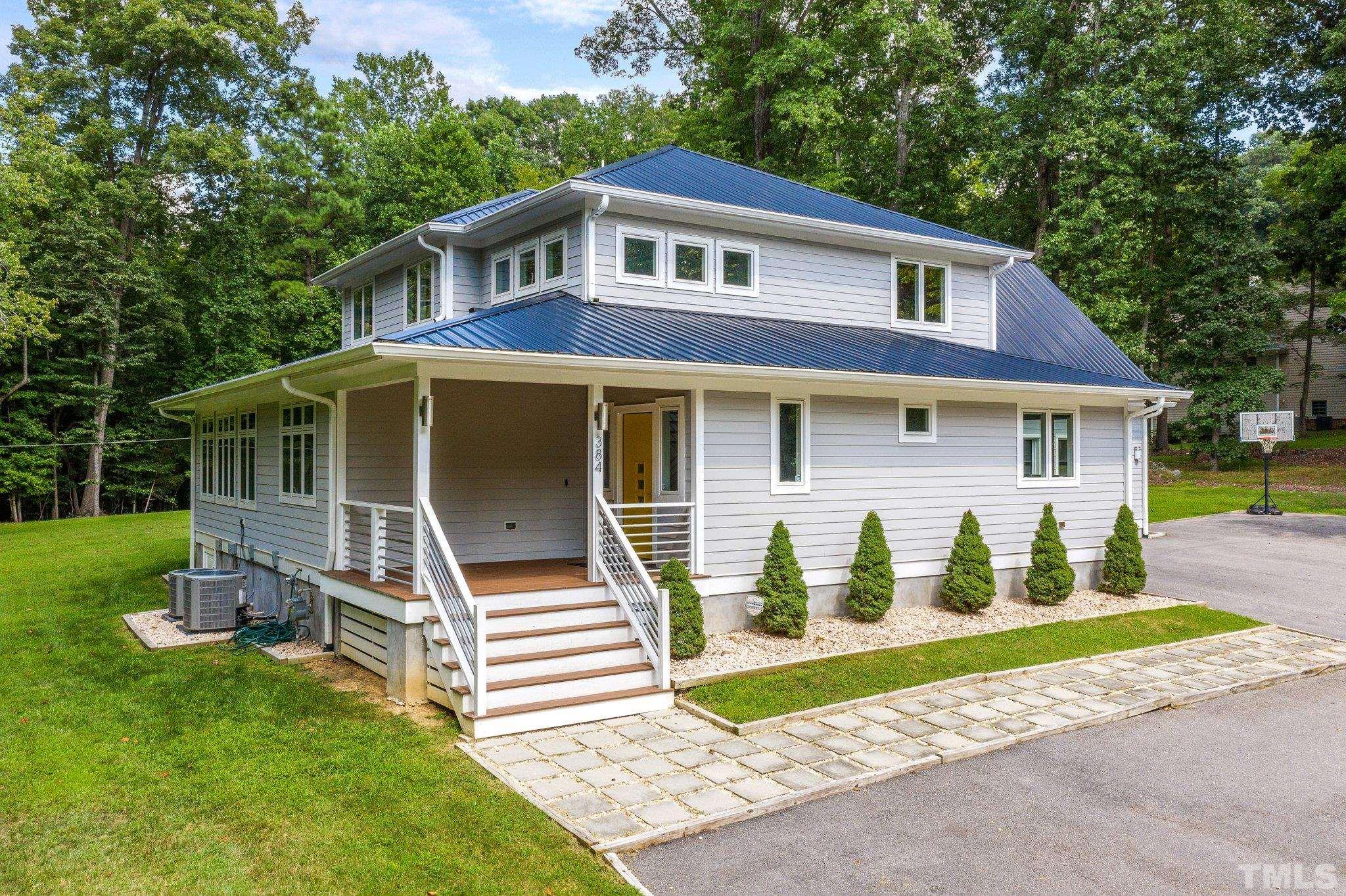 384 Booth Road Chapel Hill, NC 27516 - Photo 29 of 30 a front view of a house with a yard and fence