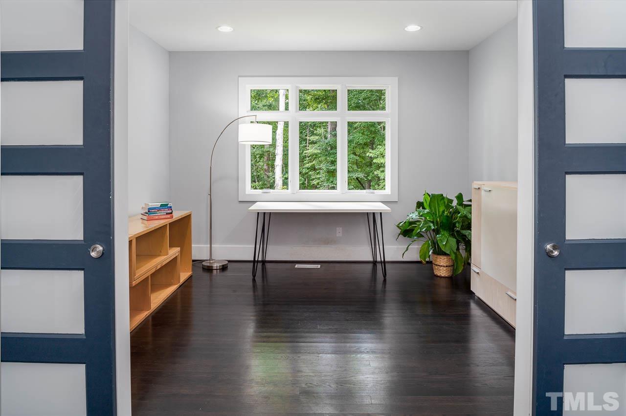 384 Booth Road Chapel Hill, NC 27516 - Photo 5 of 30 a view of an entryway with wooden floor and a potted plant