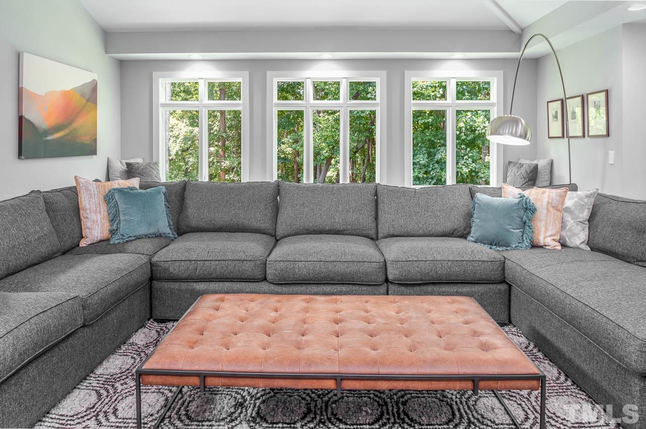 384 Booth Road Chapel Hill, NC 27516 - Photo 7 of 30 a living room with a couch and a large window