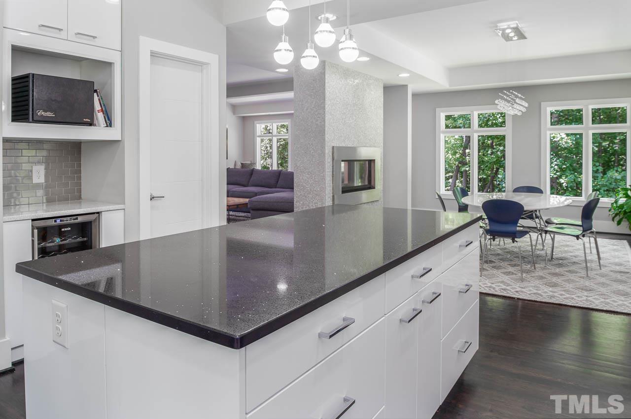 384 Booth Road Chapel Hill, NC 27516 - Photo 10 of 30 a kitchen with sink a microwave and living room view