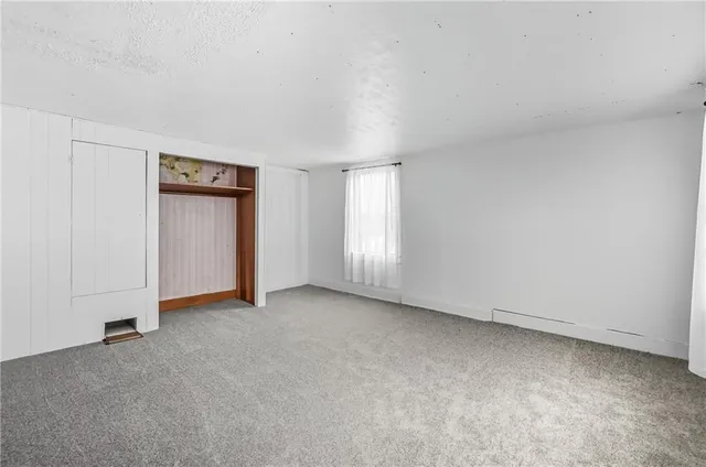 a view of a bathroom with a window and a shower