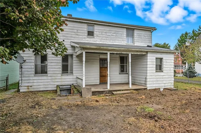 a house that has a window in front of it