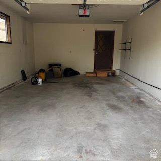 4709 East Independence Road Myton, UT 84052 - Photo 26 of 27 Garage featuring a garage door opener