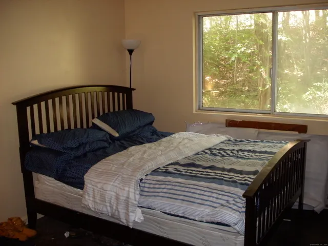 a bathroom with a toilet and shower