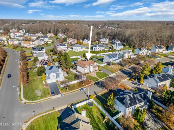 an aerial view of residential houses with outdoor space