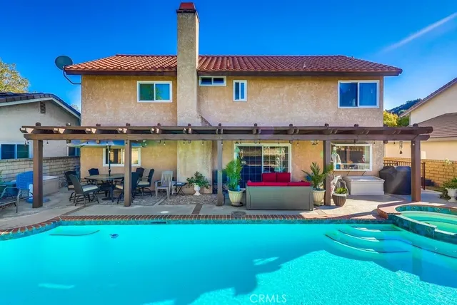 a view of a house with a yard patio and a patio