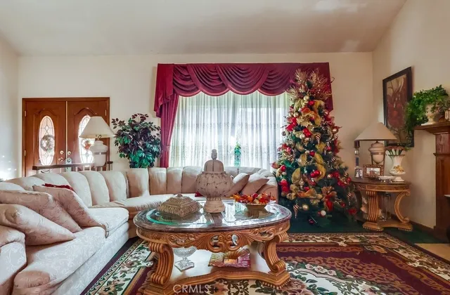 a view of a dining room with furniture and chandelier