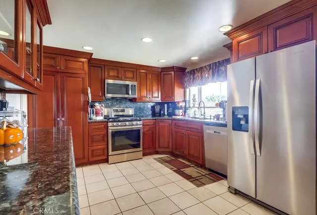 a living room with fireplace furniture and a floor to ceiling window