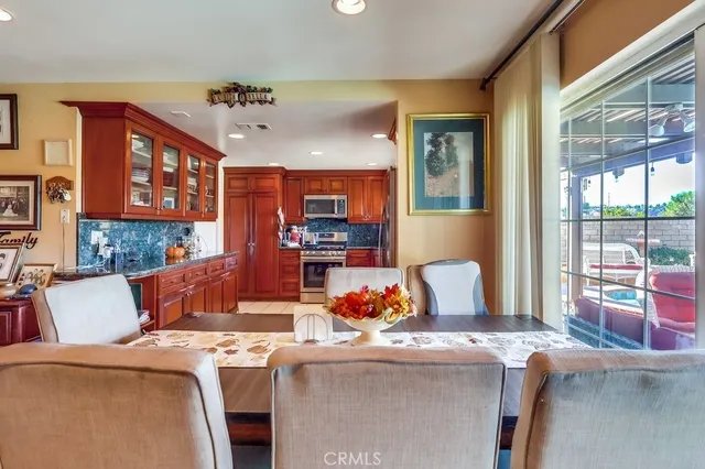 a view of a dining room with furniture window and outside view