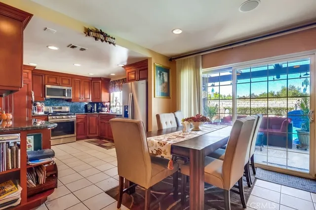 a living room with furniture a rug and a large window