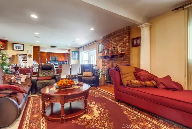 a living room filled with furniture and a flat screen tv