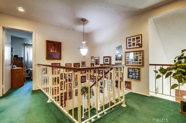 a bathroom with a sink vanity mirror and toilet
