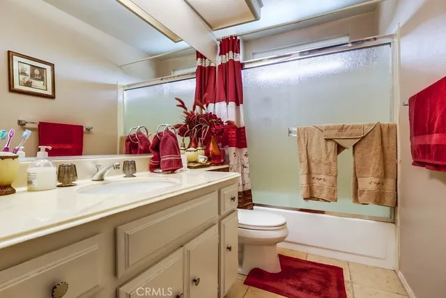 a bed room with a bed and a chandelier