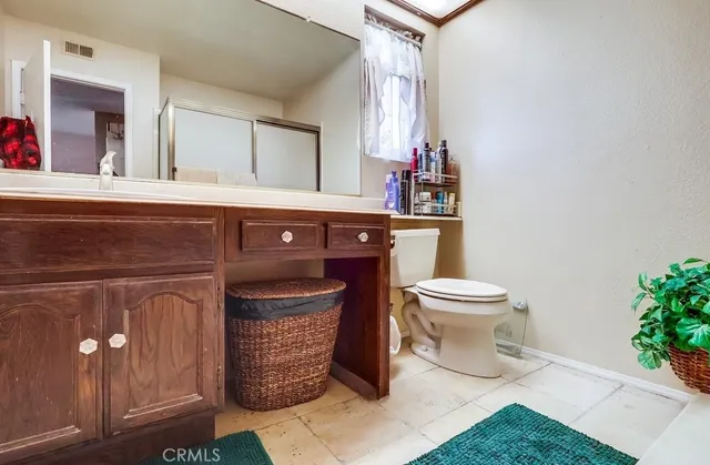 a bathroom with a toilet and a sink