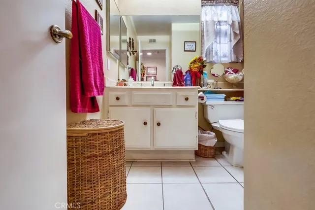 a view of a patio with a table chairs and a umbrella