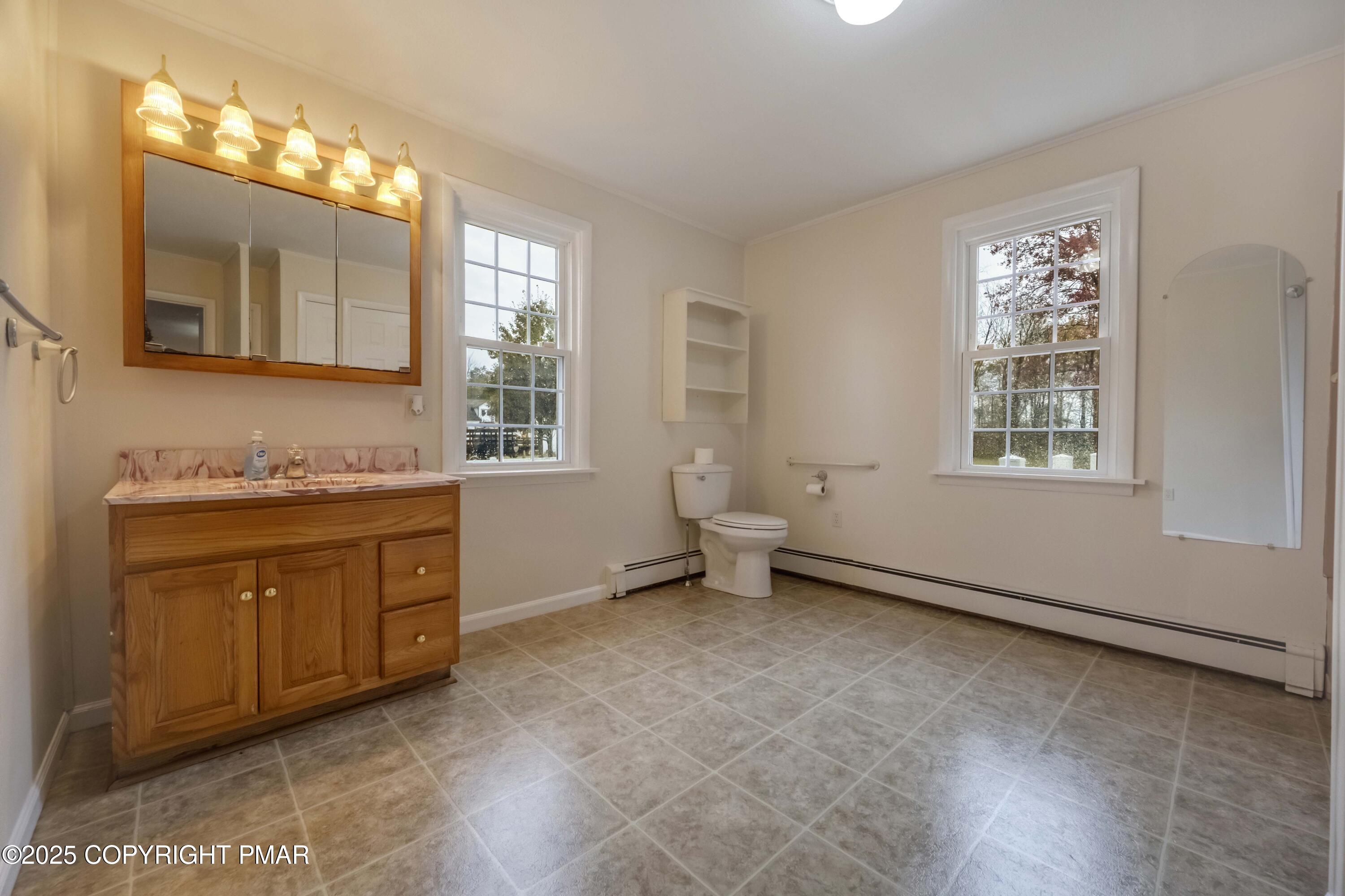 2917 Long Pond Road Long Pond, PA 18334 - Photo 14 of 30 a spacious bathroom with a granite countertop sink mirror and a bathtub