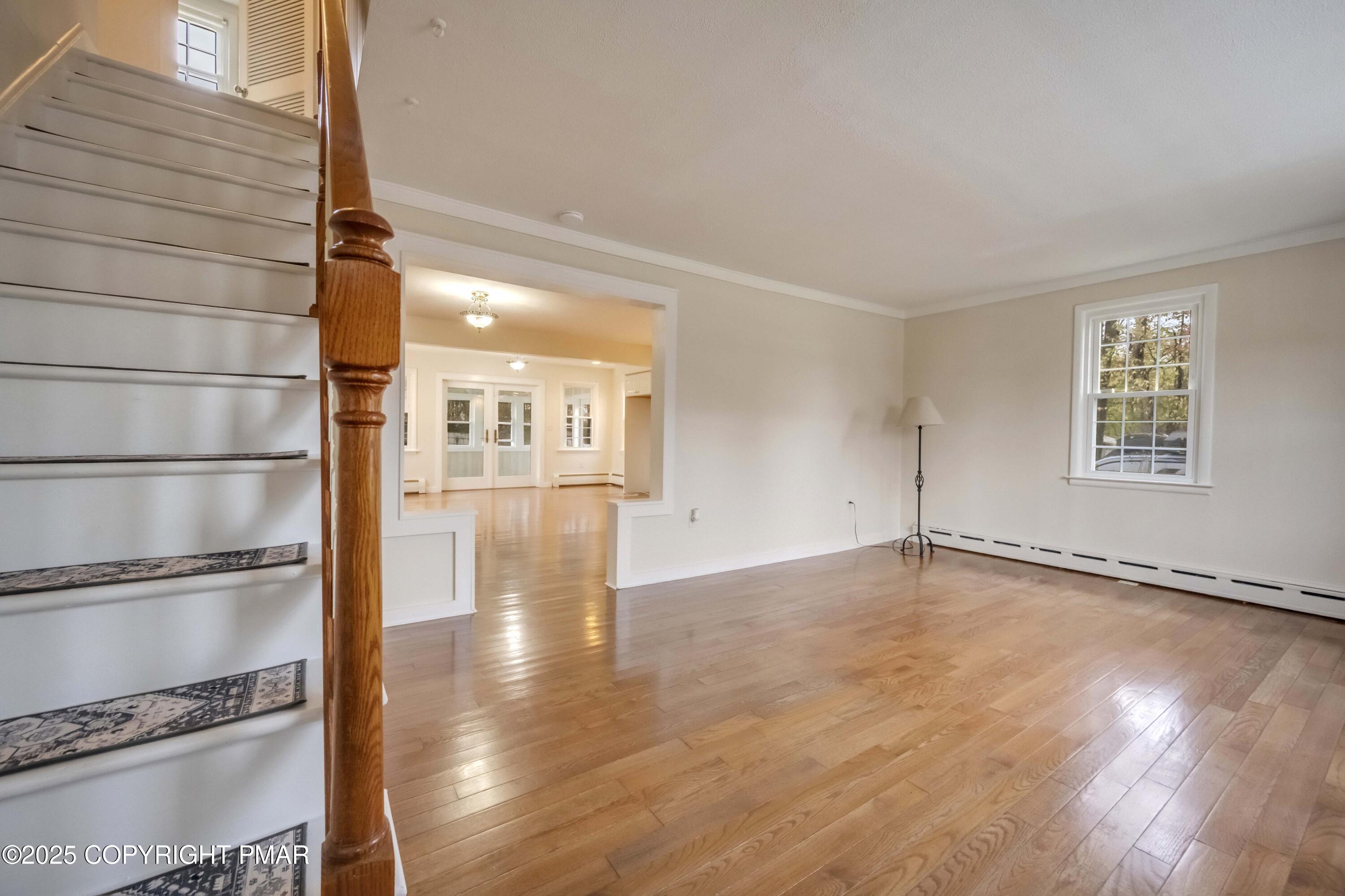 2917 Long Pond Road Long Pond, PA 18334 - Photo 4 of 30 a view of an empty room with wooden floor and a window