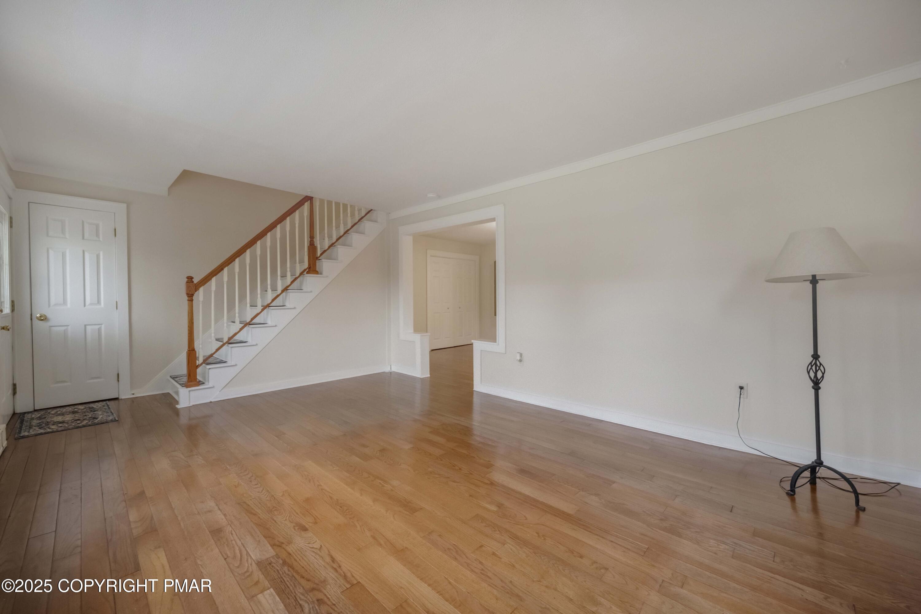 2917 Long Pond Road Long Pond, PA 18334 - Photo 5 of 30 a view of an empty room with wooden floor and stairs