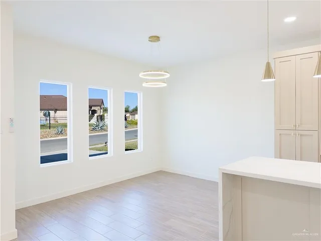 a view of empty room with windows