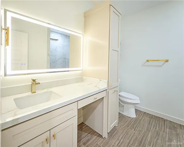 a bathroom with a sink and a toilet
