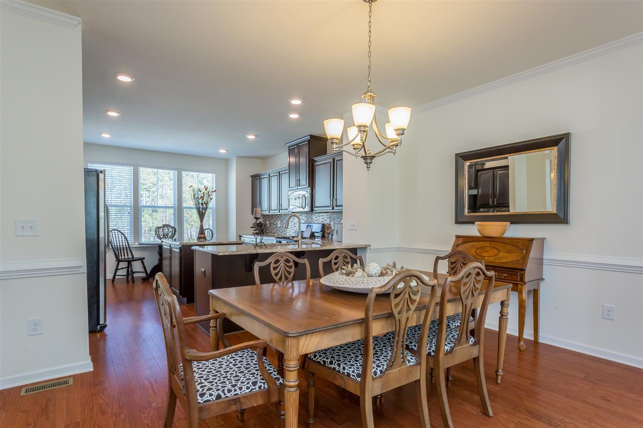 605 Edgewater Ridge Court Apex, NC 27523 - Photo 7 of 25 Large dining area with chair railing