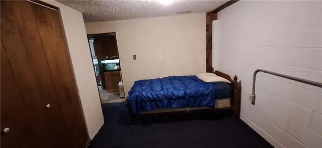 a bedroom with a bed and a mirror