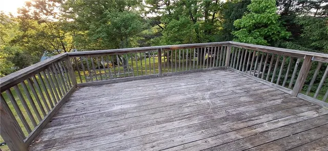 a view of balcony with wooden floor