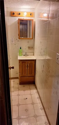 a bathroom with a bathtub and a sink