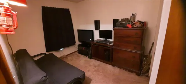a kitchen with a refrigerator and a stove