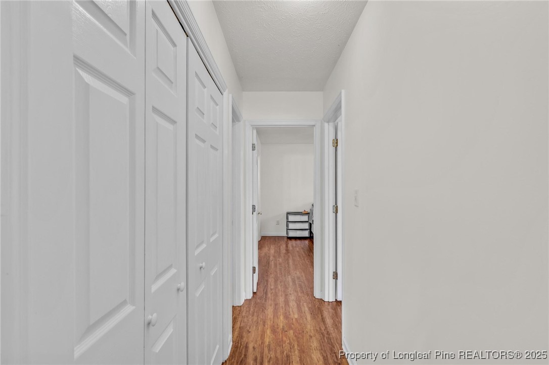 317 Kernstown Road Raeford, NC 28376 - Photo 24 of 32 a view of a hallway with wooden floor