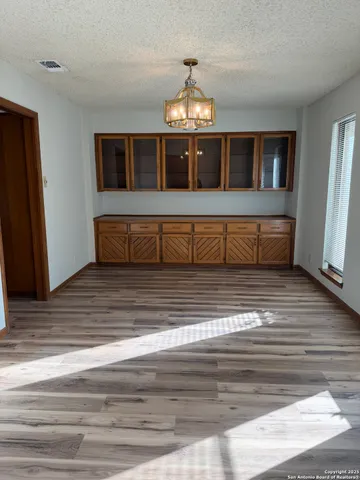 a spacious bathroom with a double vanity sink and a large mirror