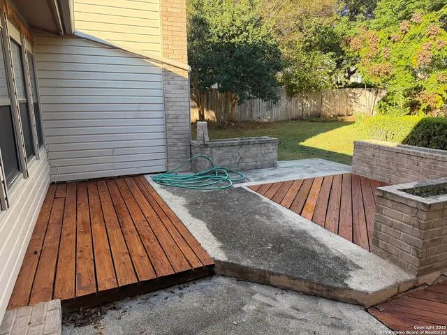 a balcony with wooden floor