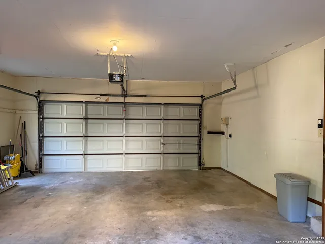 a view of a kitchen with furniture and wooden floor