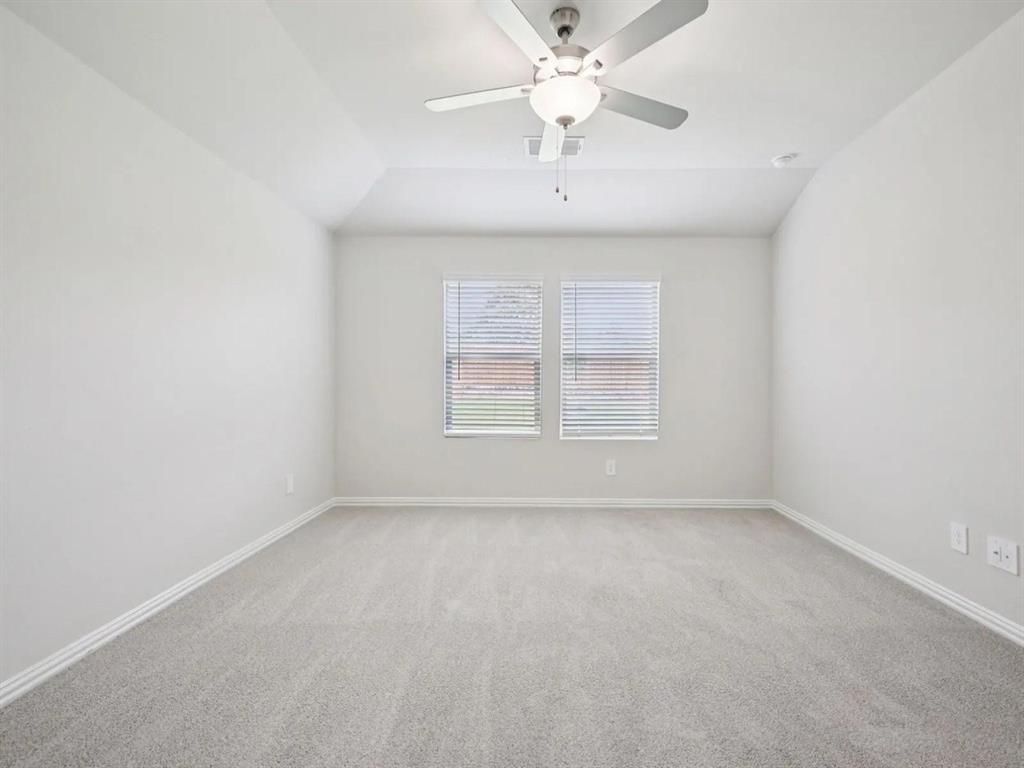 6400 Texas Ranger Trail Fort Worth, TX 76123 - Photo 7 of 14 an empty room with a window and a fan