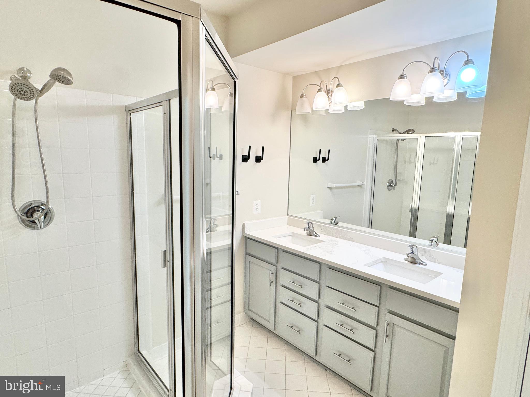 2304 Margraf Circle Woodbridge, VA 22191 - Photo 17 of 27 a bathroom with a double vanity sink mirror and double
