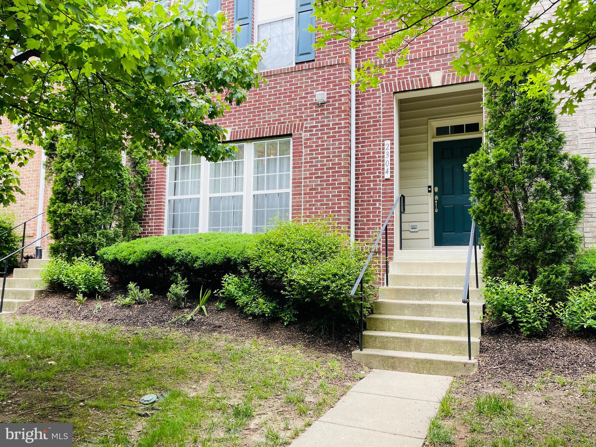 2304 Margraf Circle Woodbridge, VA 22191 - Photo 25 of 27 a front view of a house with plants and garden