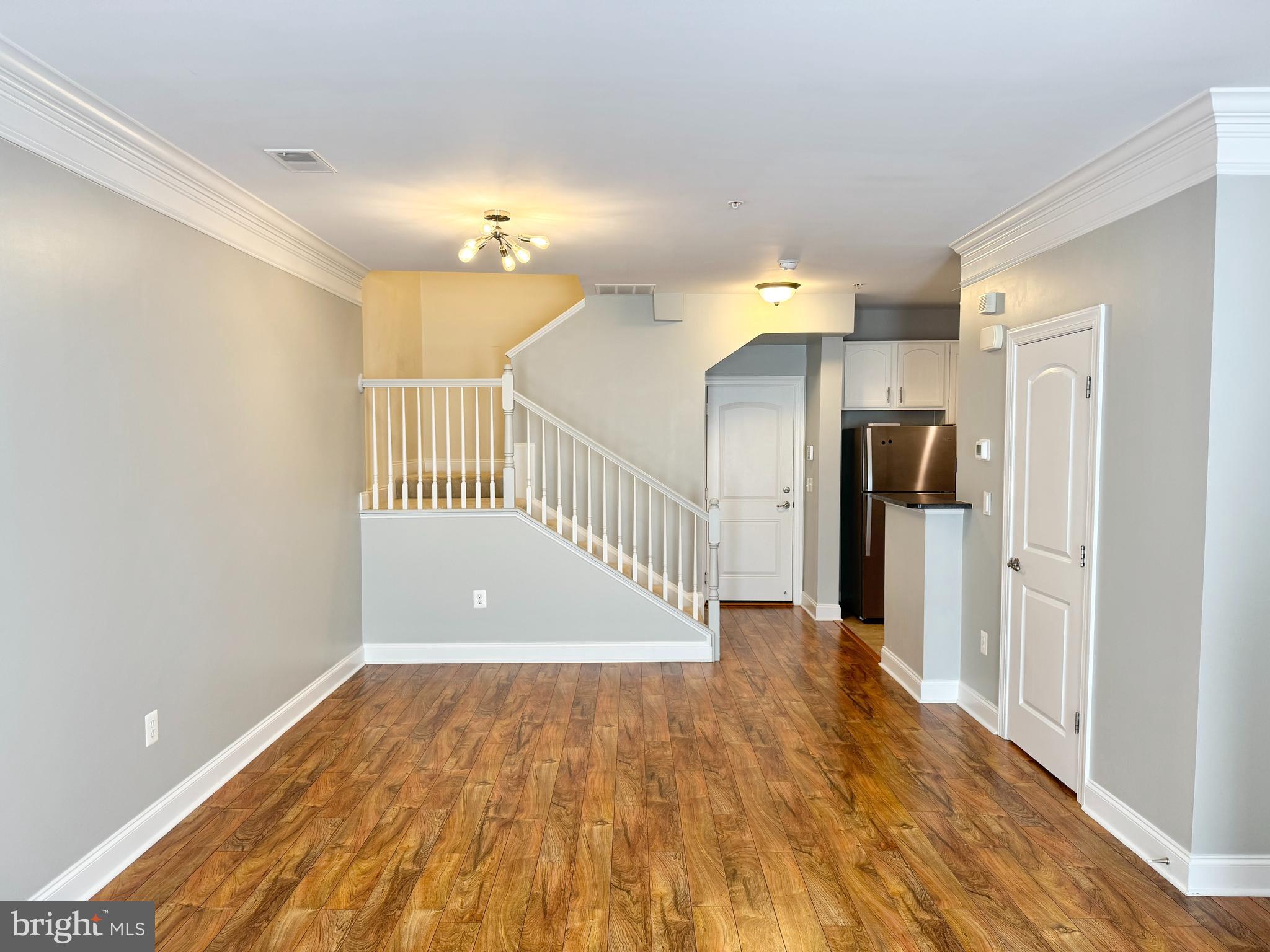 2304 Margraf Circle Woodbridge, VA 22191 - Photo 3 of 27 a view of a hallway view with wooden floor and staircase